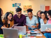 Group of entrepreneurs collaborating in a modern workspace.